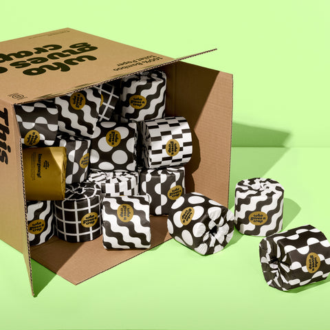 Bamboo Toilet Paper in black and white designed packaging spilling out of shipping box